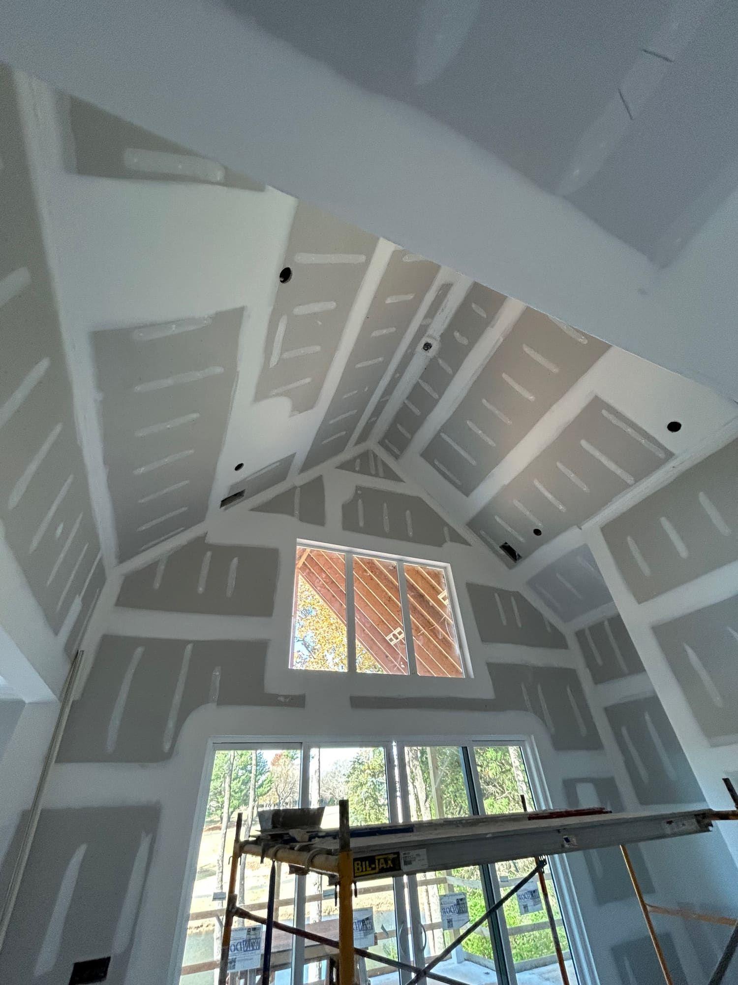 Drywall finishing on vaulted ceiling and dormer window
