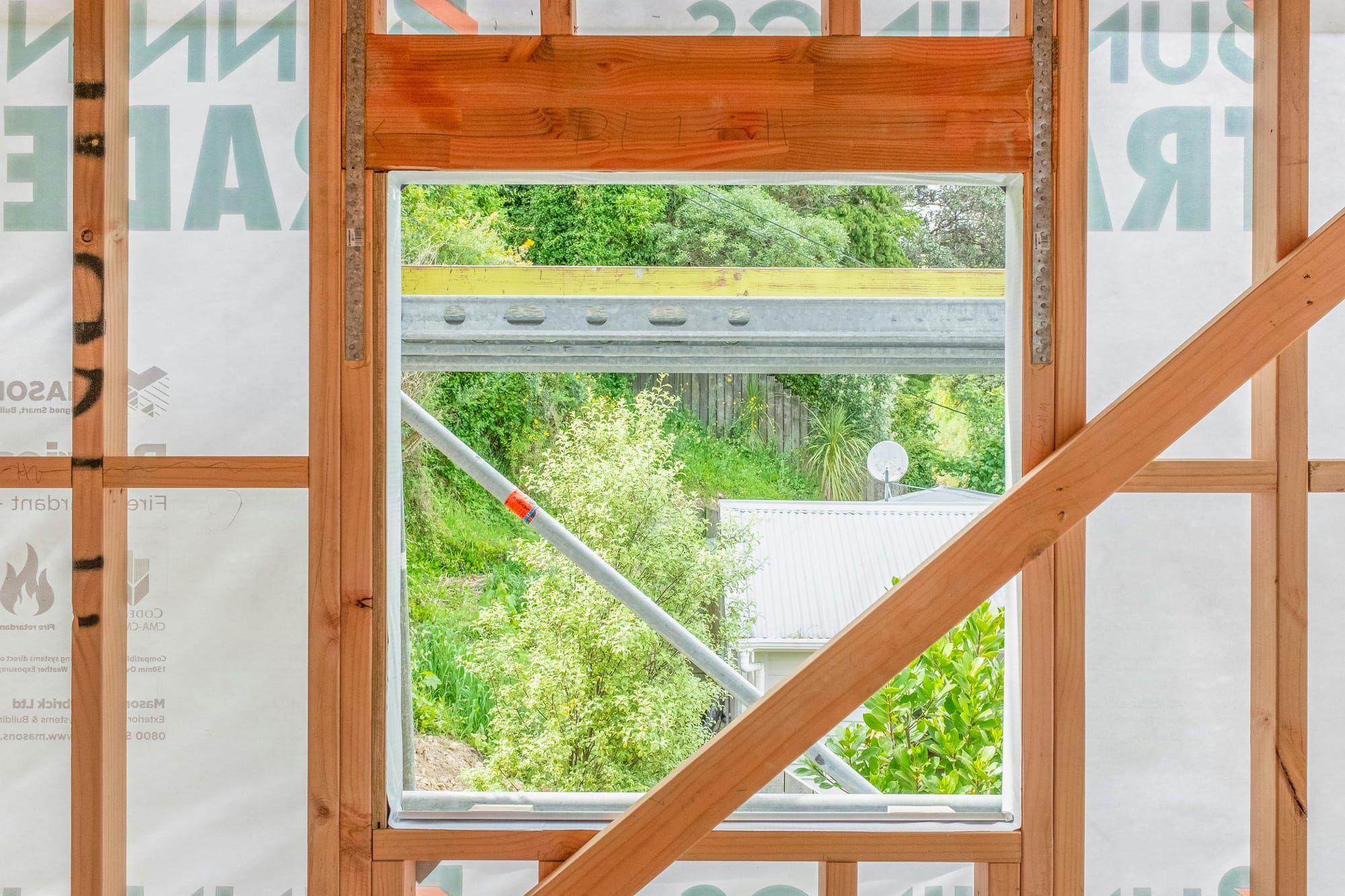 Framed window opening with header during construction