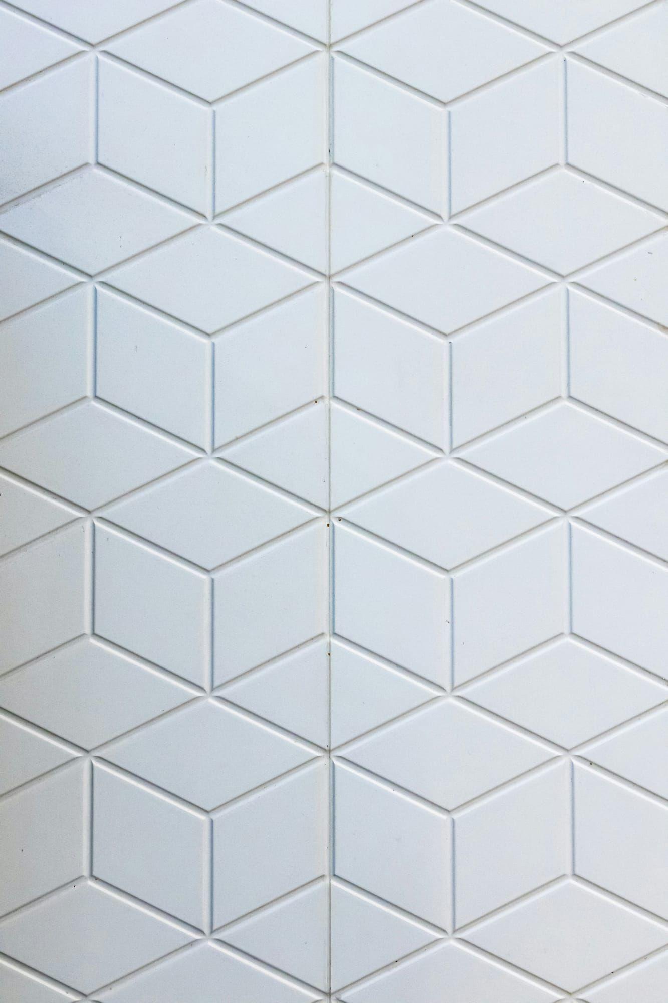 White dimensional cube-pattern tile wall detail